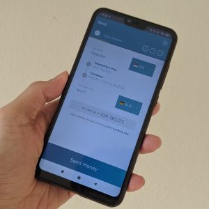 menggunakan aplikasi Transfez